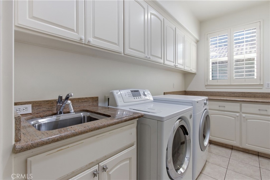 2144 King Arthur Court Merced, CA 95340 - Photo 23 of 66 a utility room with sink dryer and washer