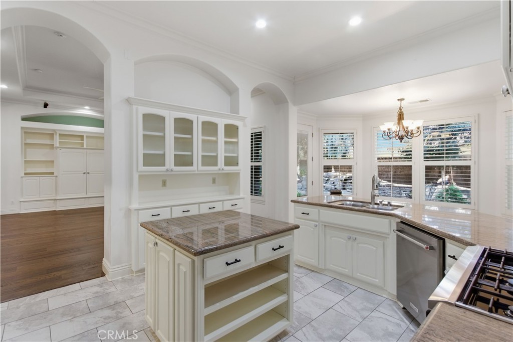 2144 King Arthur Court Merced, CA 95340 - Photo 24 of 66 a kitchen with a sink stove and cabinets