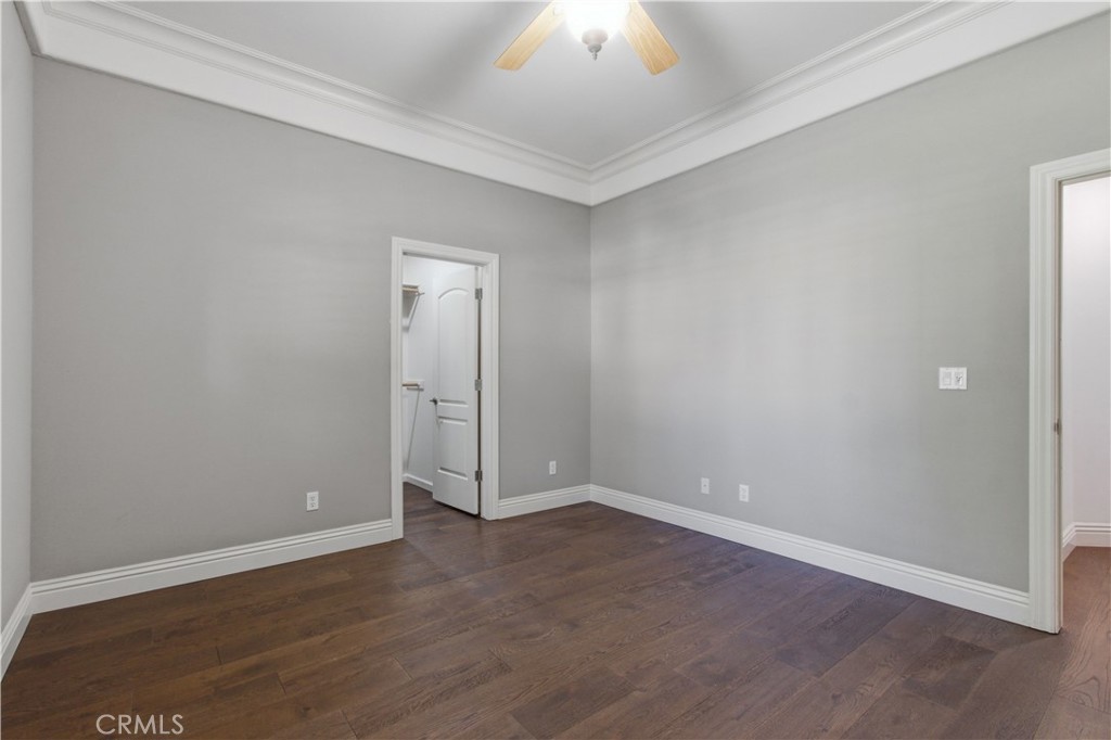 2144 King Arthur Court Merced, CA 95340 - Photo 32 of 66 an empty room with wooden floor and windows
