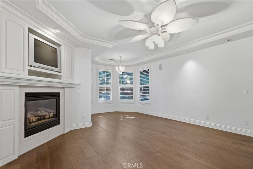 2144 King Arthur Court Merced, CA 95340 - Photo 36 of 66 a view of an empty room with wooden floor and a fireplace