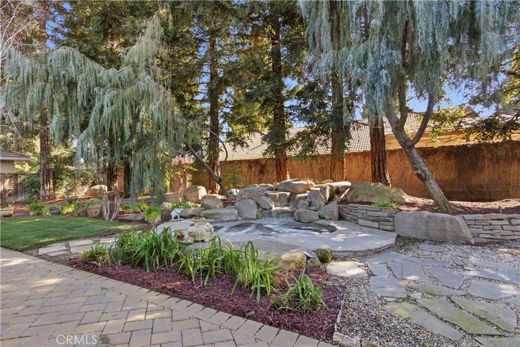 2144 King Arthur Court Merced, CA 95340 - Photo 48 of 66 a view of table and chairs with wooden fence