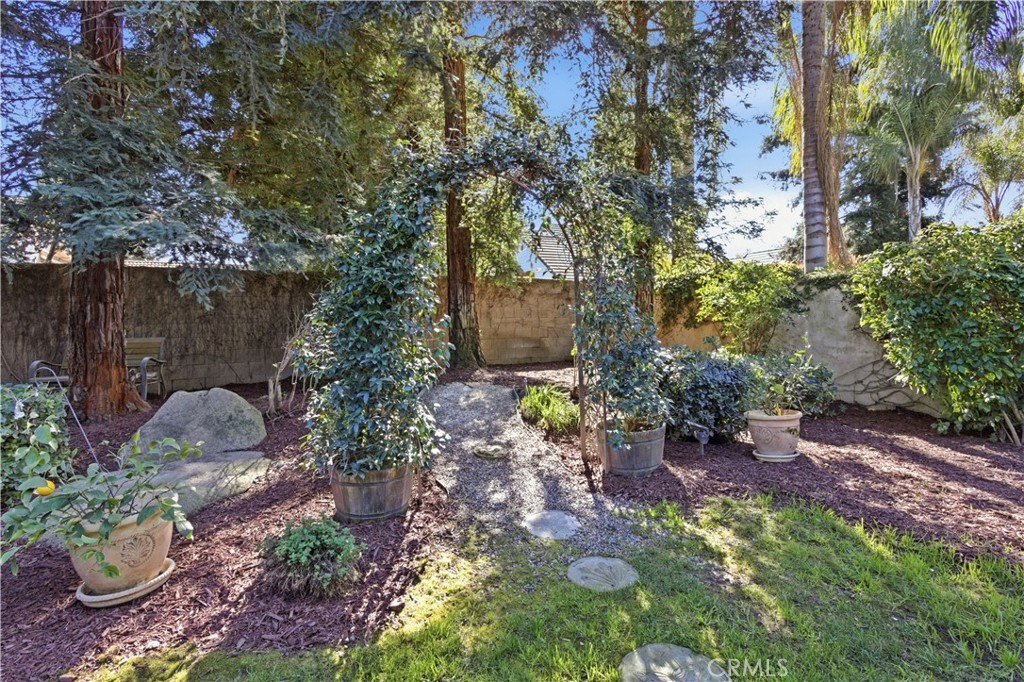 2144 King Arthur Court Merced, CA 95340 - Photo 51 of 66 a view of a garden with plants and large trees
