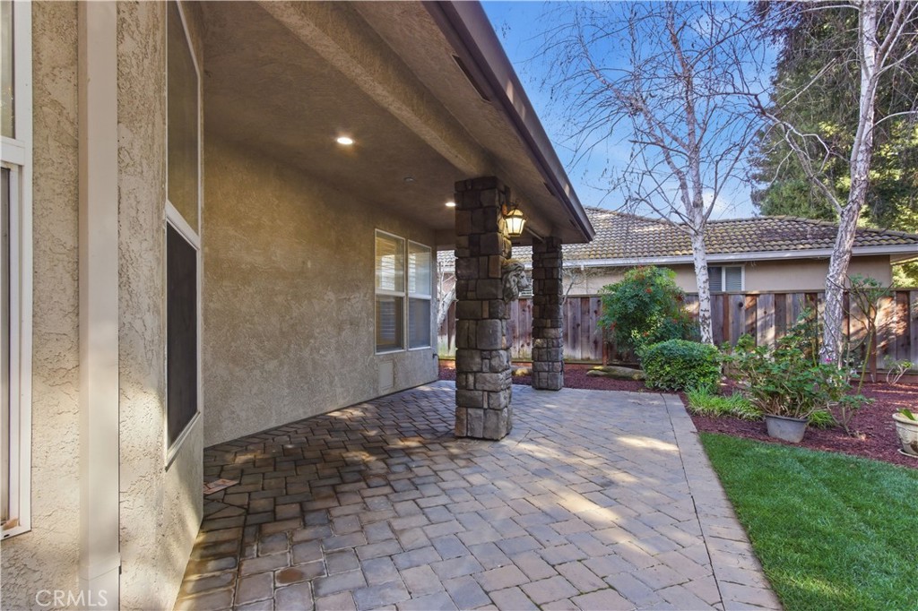 2144 King Arthur Court Merced, CA 95340 - Photo 56 of 66 a view of a patio with table and chairs and potted plants
