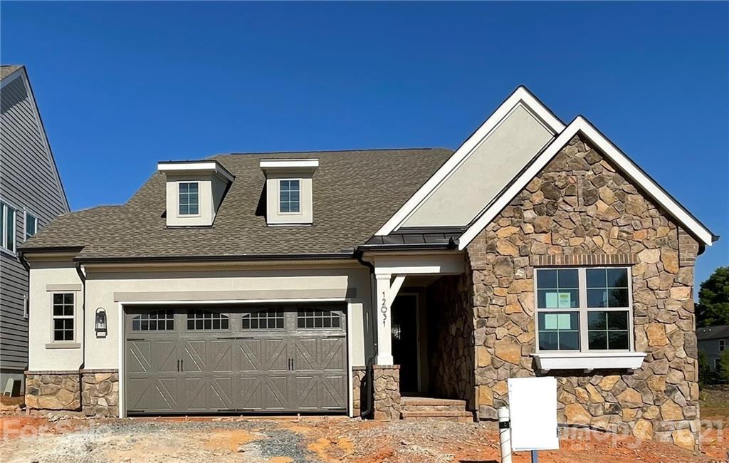 12031 Huntson Reserve Road Huntersville, NC 28078 - Photo 1 of 23 a front view of a house with garage