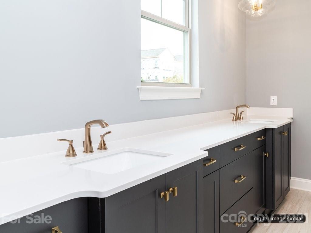 12031 Huntson Reserve Road Huntersville, NC 28078 - Photo 12 of 23 a bathroom with a sink and a mirror