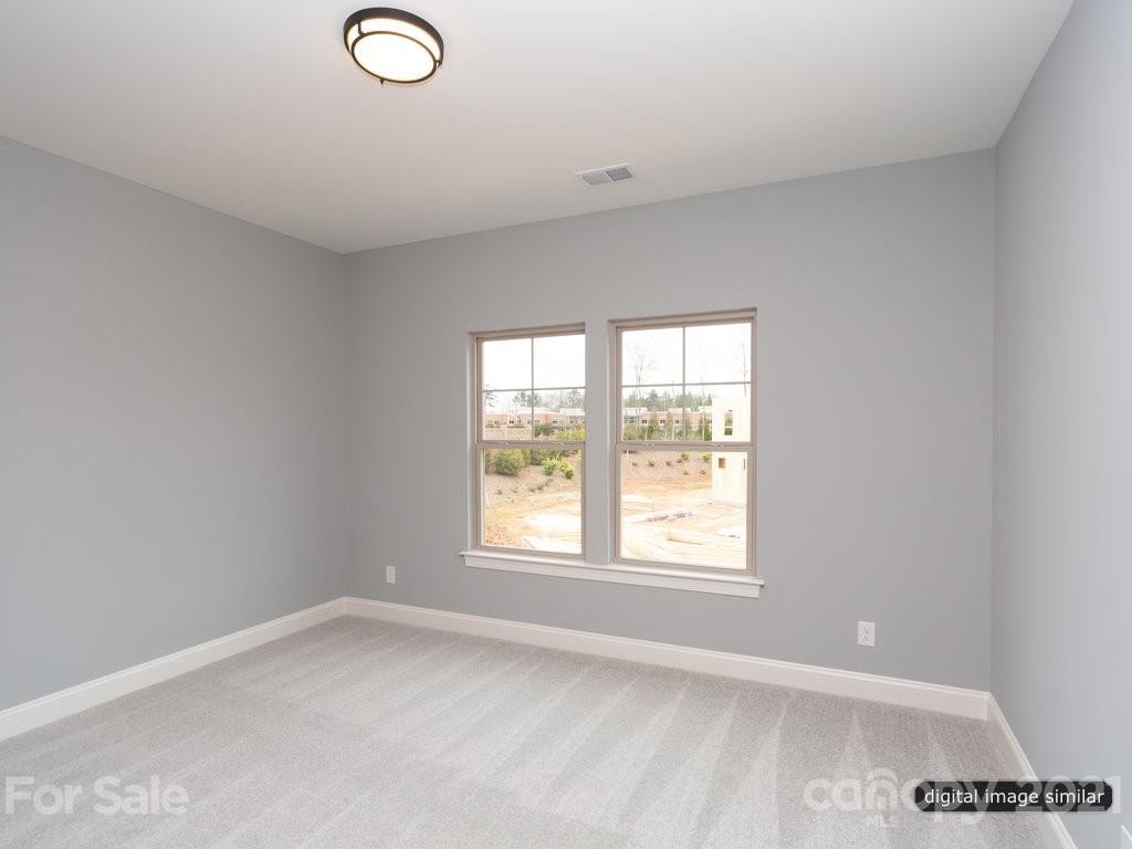 12031 Huntson Reserve Road Huntersville, NC 28078 - Photo 19 of 23 an empty room with a window