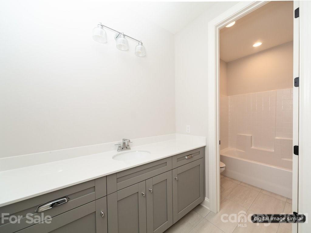 12031 Huntson Reserve Road Huntersville, NC 28078 - Photo 21 of 23 a bathroom with a sink and a bathtub