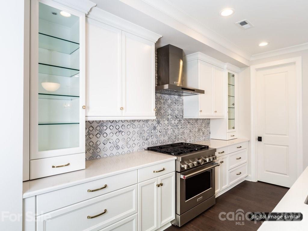 12031 Huntson Reserve Road Huntersville, NC 28078 - Photo 6 of 23 a kitchen with stainless steel appliances granite countertop a sink and a stove