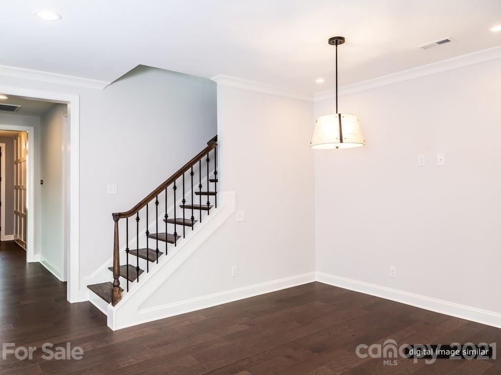 12031 Huntson Reserve Road Huntersville, NC 28078 - Photo 9 of 23 a view of an empty room with wooden floor