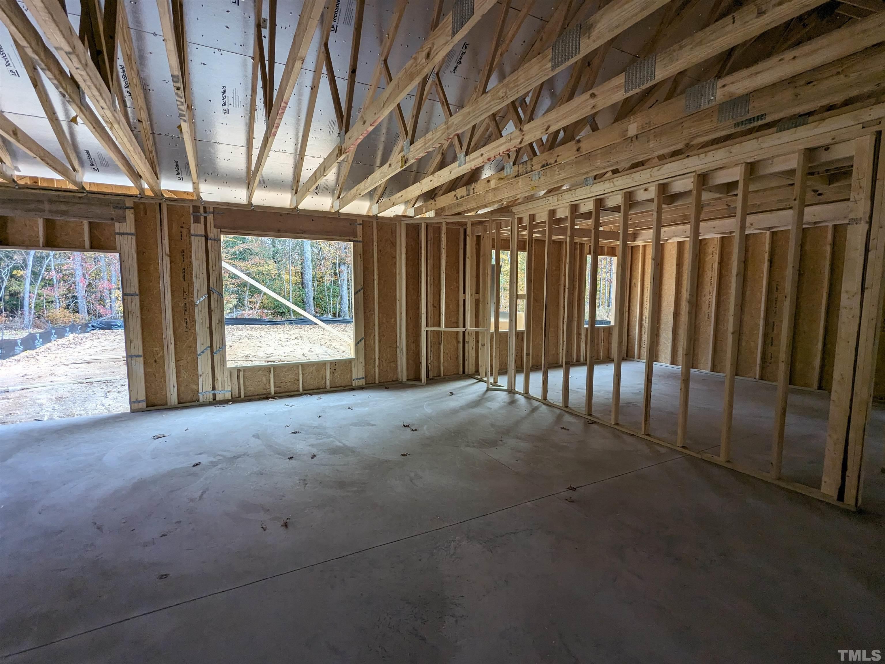 291 Ford Meadows Drive Garner, NC 27529 - Photo 7 of 13 a view of empty room with wooden floor and fan