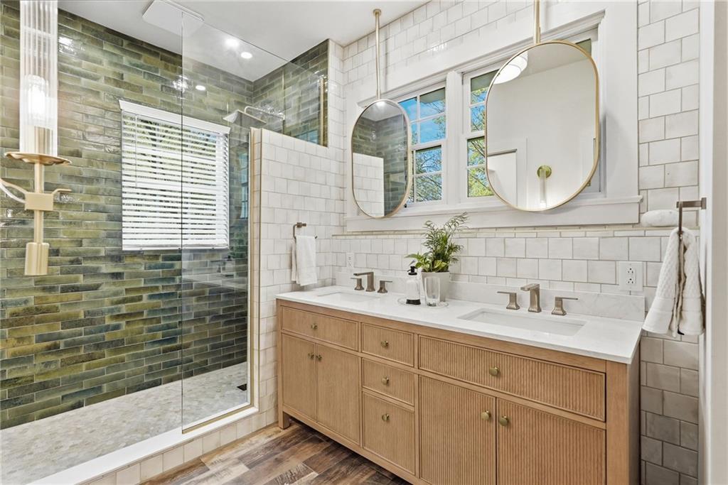 3944 Bakerstown Road Gibsonia, PA 15044 - Photo 36 of 50 a bathroom with a double vanity sink mirror and shower