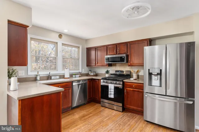 a view of a dining room with furniture and window