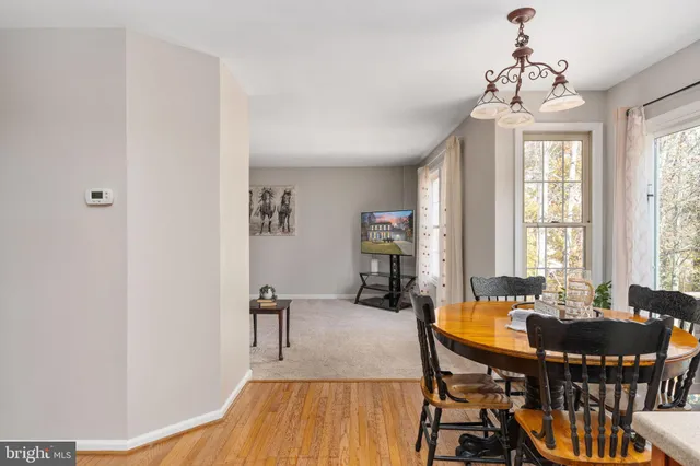 a living room with furniture and large windows