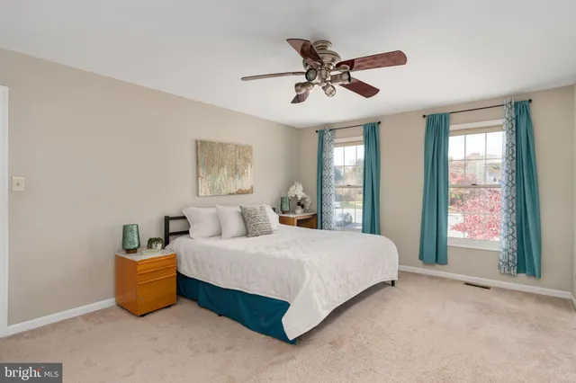 a bathroom with a tub shower and sink