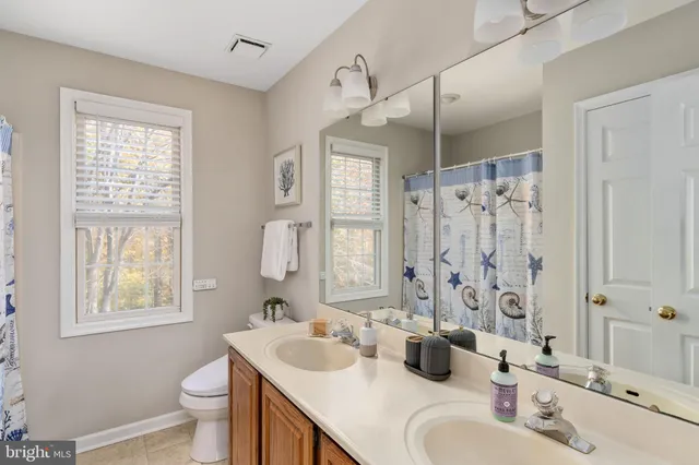 a room with a bed and a table in it