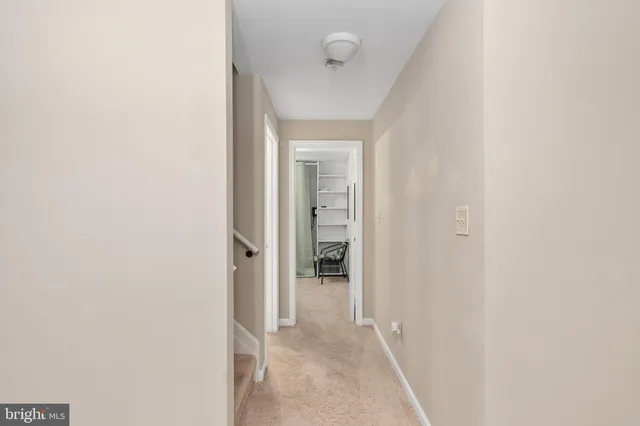 a bathroom with a sink toilet and mirror