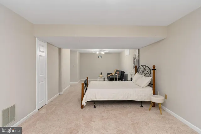 a view of a yard with wooden fence and trees