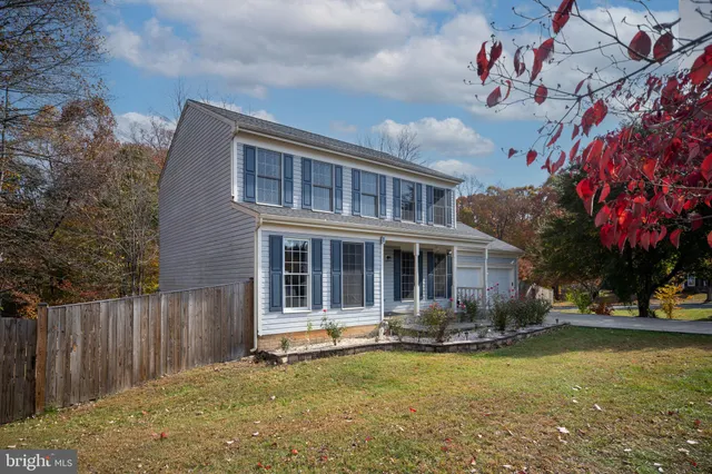 a swimming pool with outdoor seating and yard
