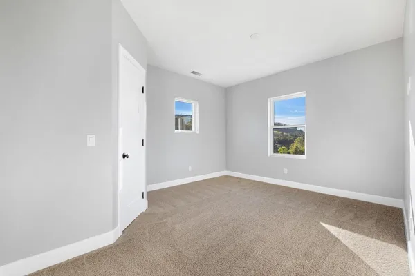 an empty room with windows