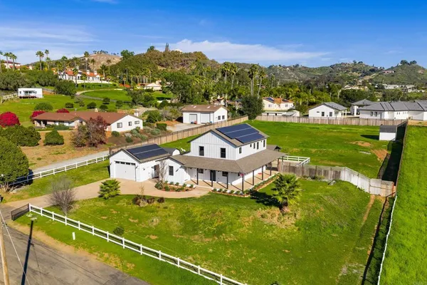 a view of a house with a big yard