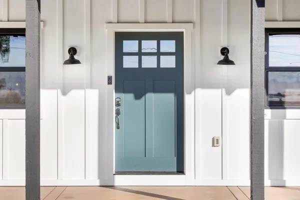 a view of front door with yard