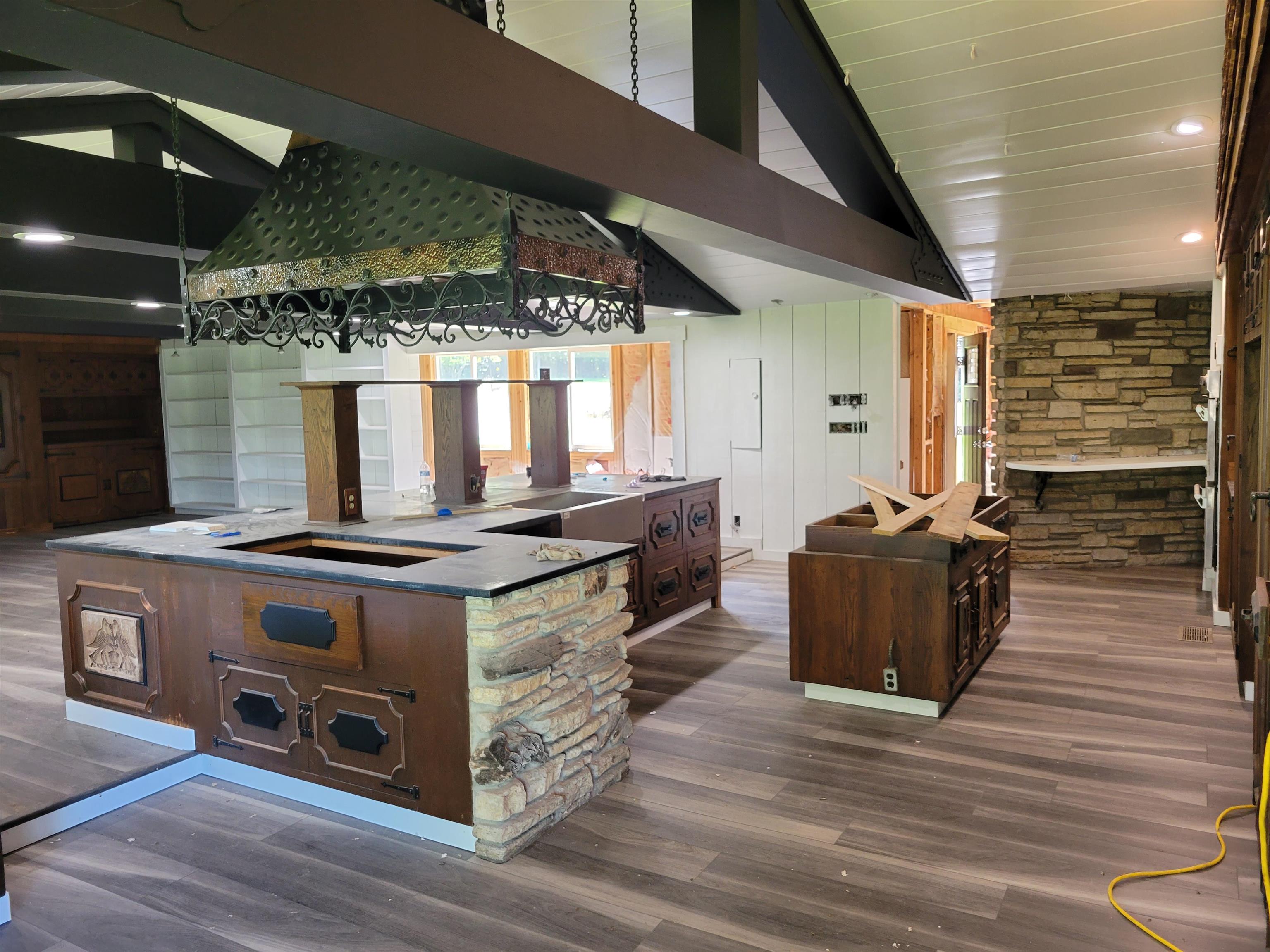 7037 Pomeroy Road Rockton, IL 61072 - Photo 11 of 35 a kitchen with stainless steel appliances granite countertop a stove and a wooden floors