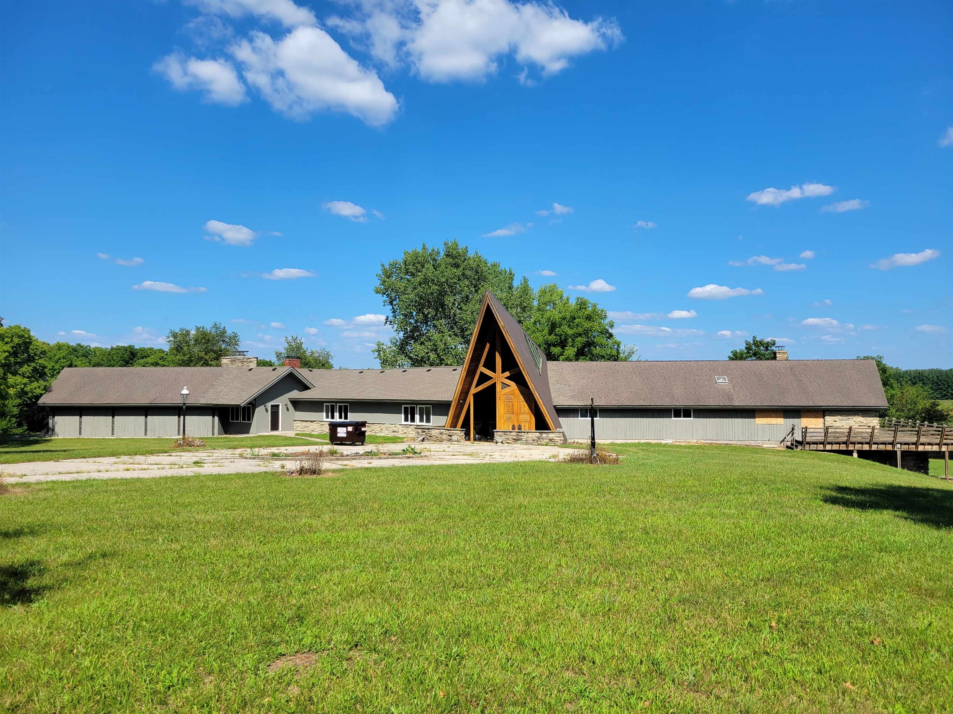 7037 Pomeroy Road Rockton, IL 61072 - Photo 2 of 35 a view of a swimming pool with lawn chairs and plants