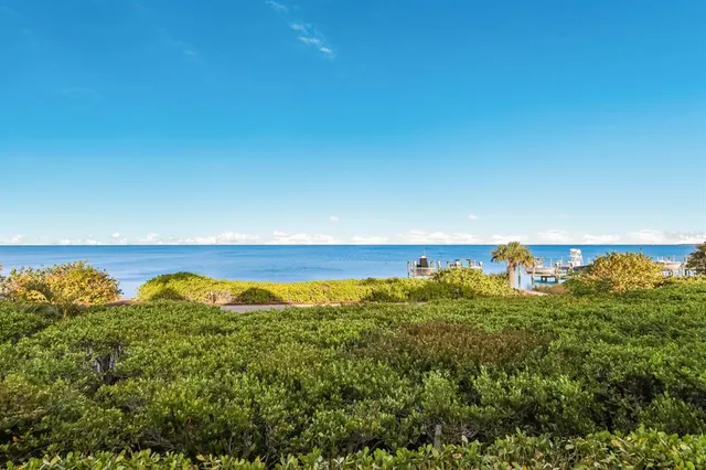 a kitchen with kitchen island granite countertop furniture and a wooden floor