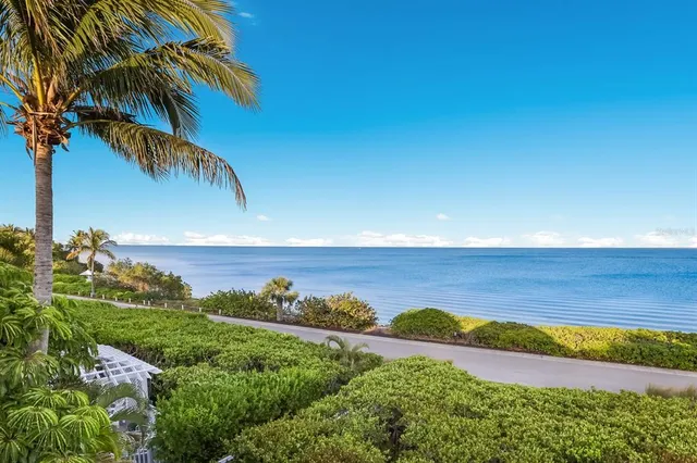a bathroom with a sink vanity granite toilet and shower