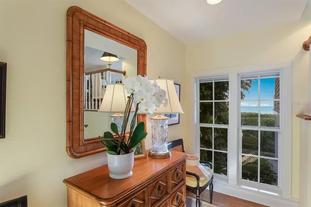 a balcony with furniture and garden view