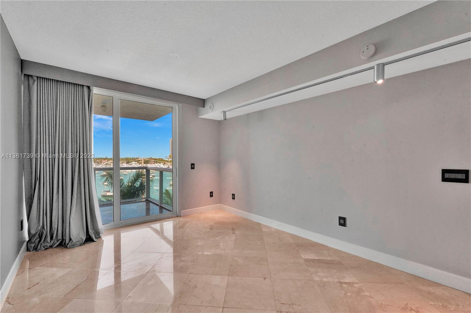 10 Venetian Way, Unit 603 Miami Beach, FL 33139 - Photo 11 of 30 a view of a room with a sink and glass door