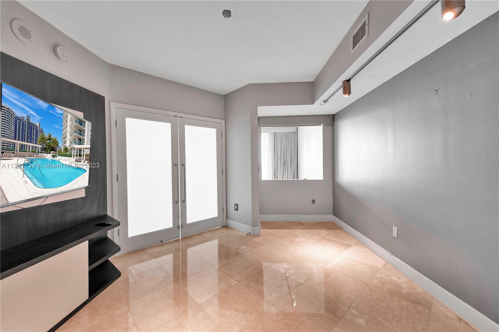 10 Venetian Way, Unit 603 Miami Beach, FL 33139 - Photo 18 of 30 a view of an empty room with a window