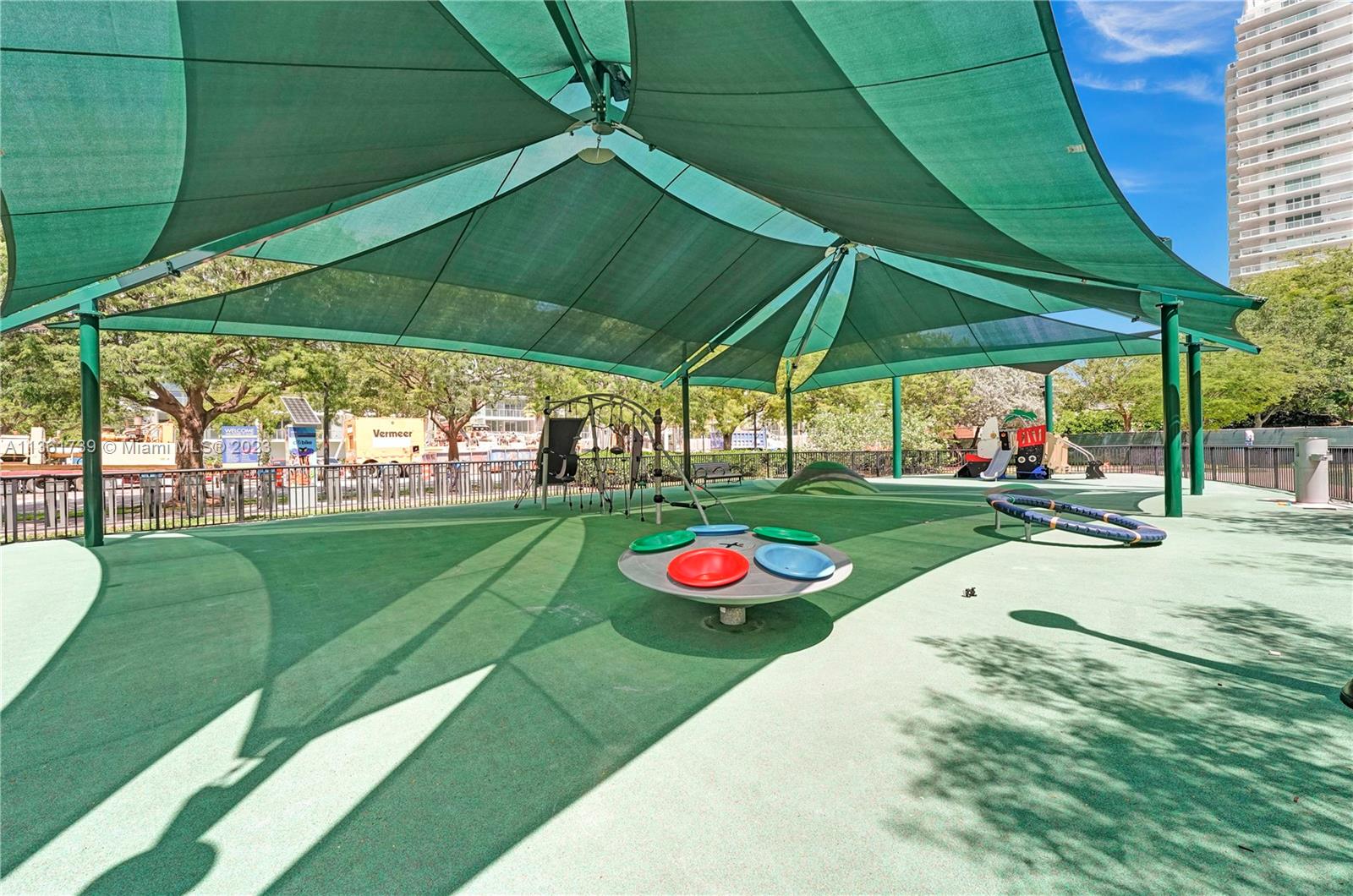 10 Venetian Way, Unit 603 Miami Beach, FL 33139 - Photo 28 of 30 a view of a table and chairs under an umbrella