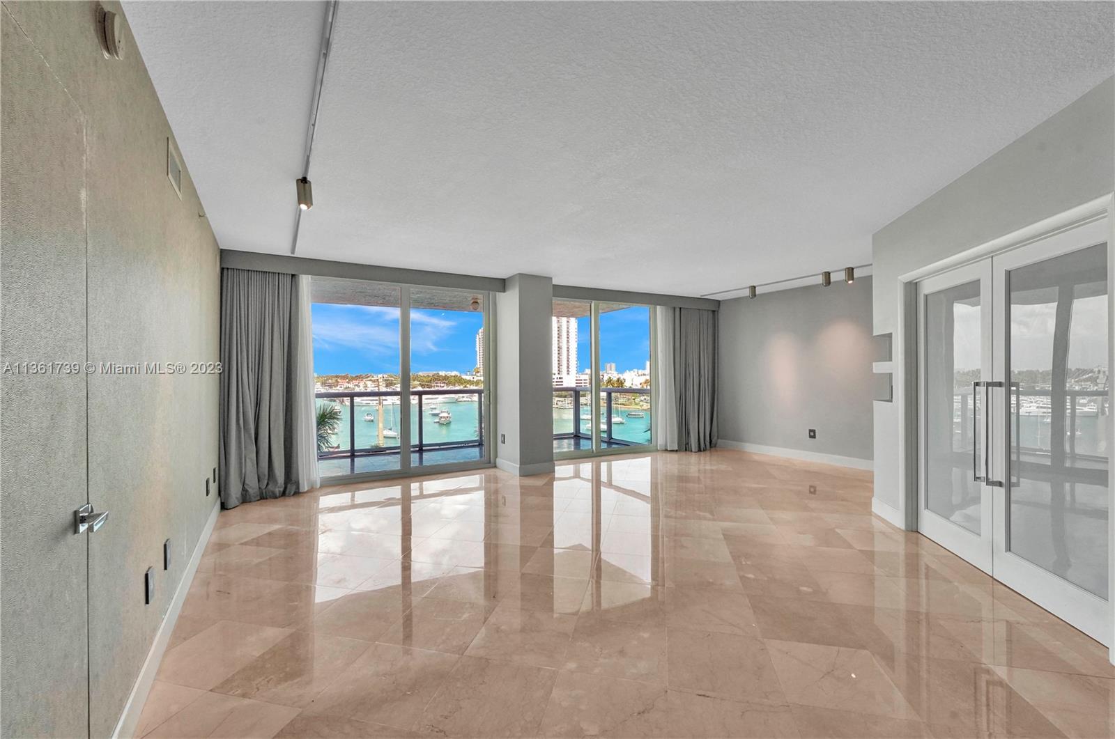 10 Venetian Way, Unit 603 Miami Beach, FL 33139 - Photo 6 of 30 a view of an empty room and window