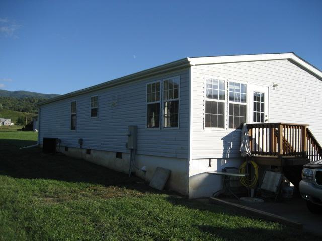 8865 Roanoke Road Elliston, VA 24087 - Photo 3 of 11 a backyard of a house with table and chairs
