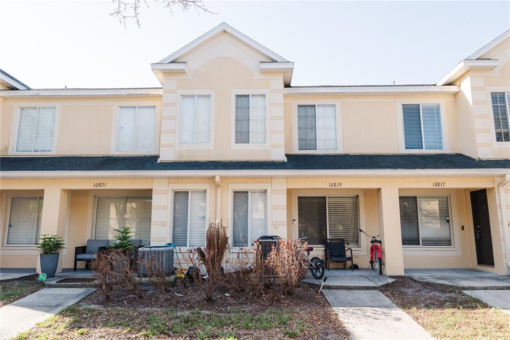 10819 Brickside Court Riverview, FL 33579 - Photo 1 of 22 a front view of a house with outdoor seating