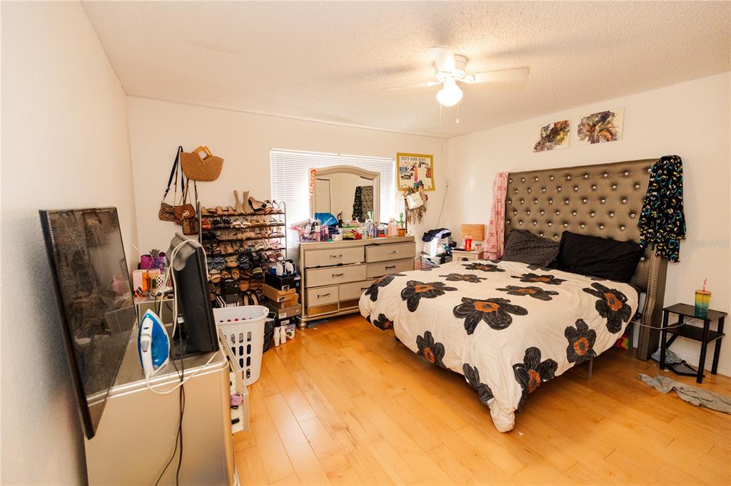 10819 Brickside Court Riverview, FL 33579 - Photo 12 of 22 a bedroom with bed and window