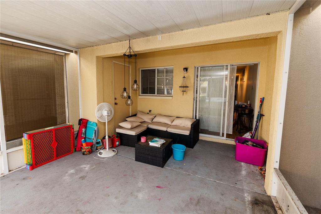 10819 Brickside Court Riverview, FL 33579 - Photo 21 of 22 a living room with blue walls and furniture