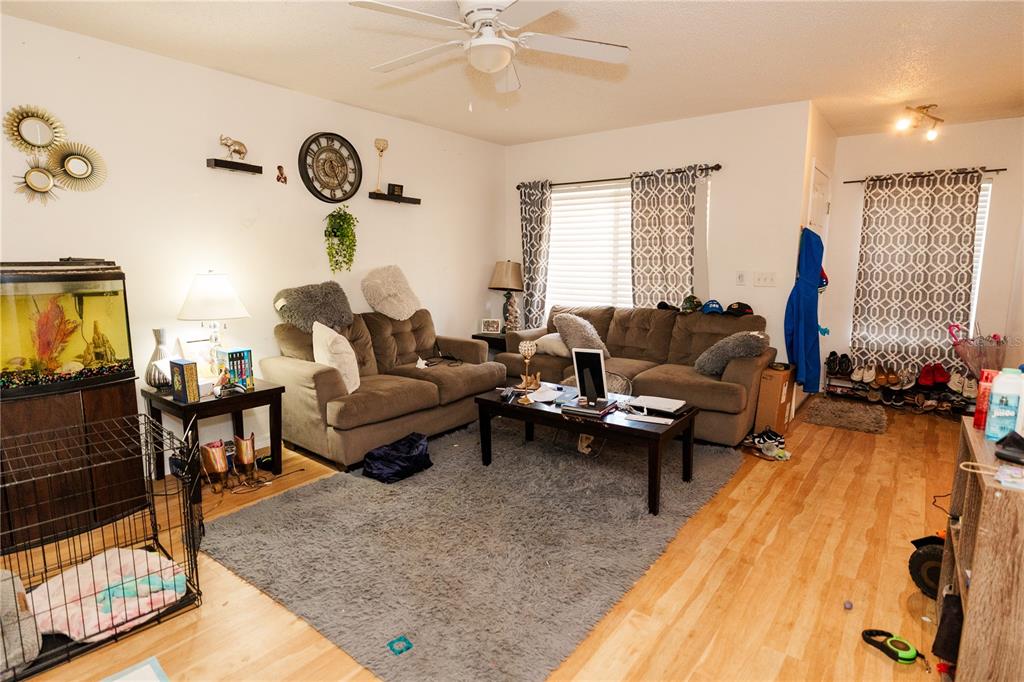 10819 Brickside Court Riverview, FL 33579 - Photo 4 of 22 a living room with furniture and a large window