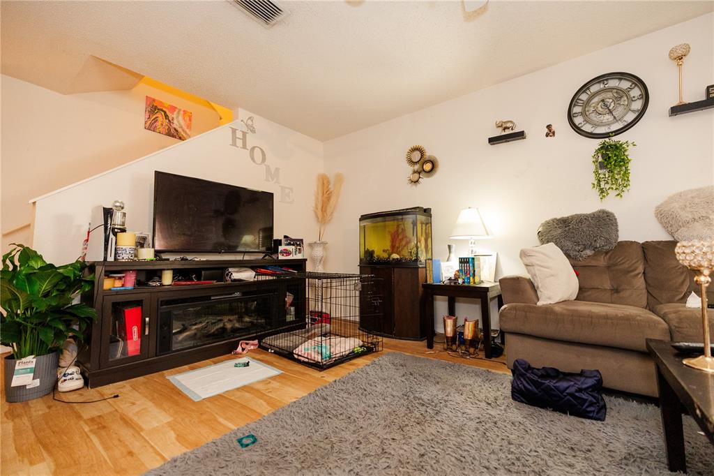 10819 Brickside Court Riverview, FL 33579 - Photo 5 of 22 a living room with furniture and a flat screen tv