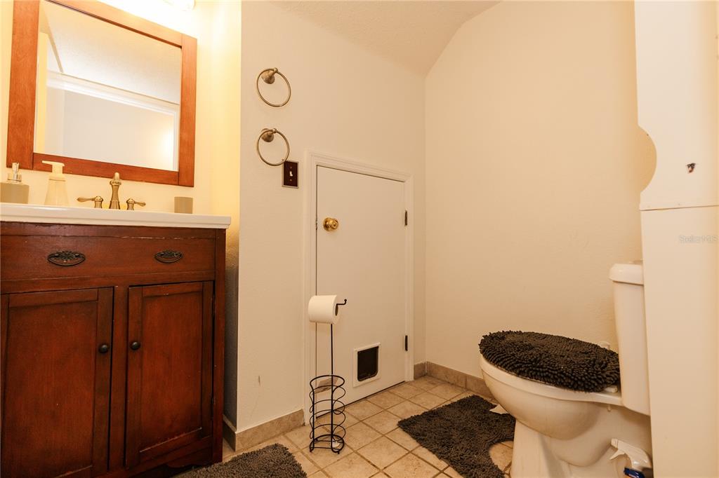 10819 Brickside Court Riverview, FL 33579 - Photo 6 of 22 a bathroom with a granite countertop sink and a mirror