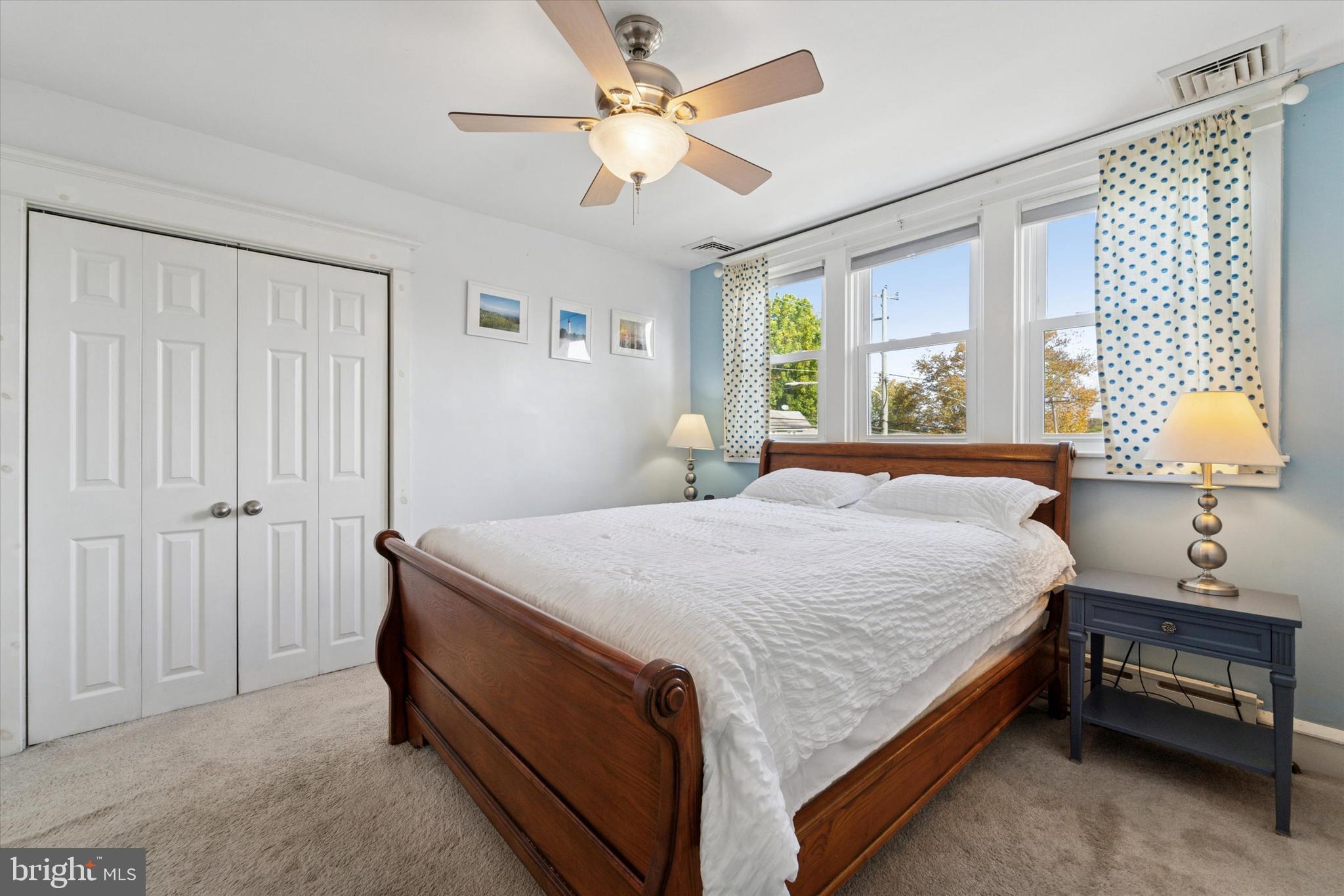 339 Sutton Avenue Folsom, PA 19033 - Photo 15 of 26 a spacious bedroom with a bed and a chandelier