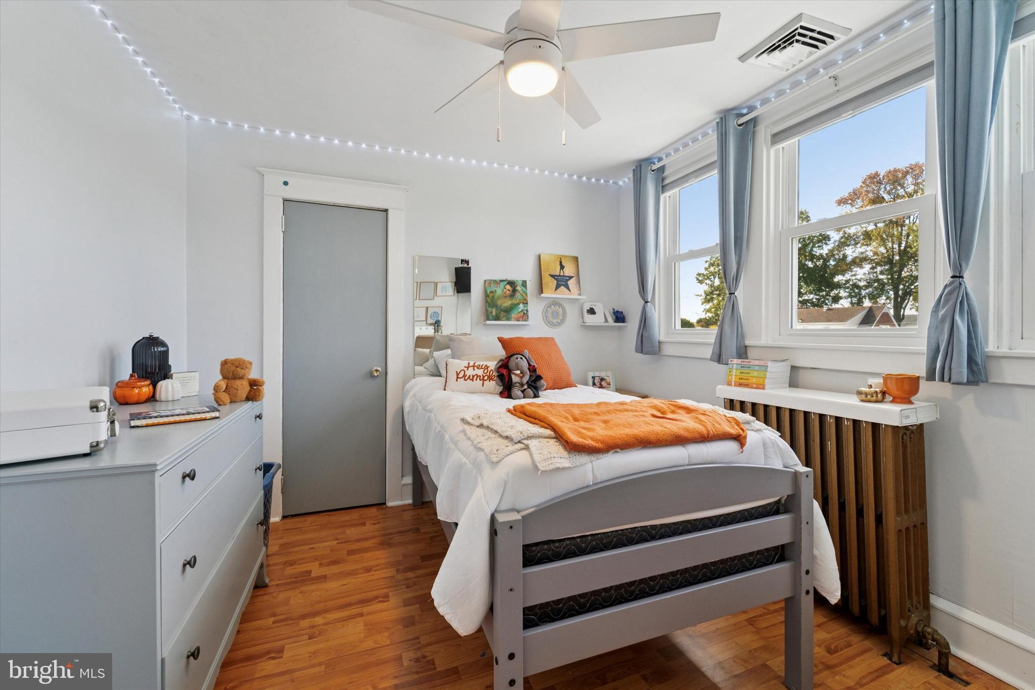 339 Sutton Avenue Folsom, PA 19033 - Photo 19 of 26 a bedroom with a bed and a chandelier