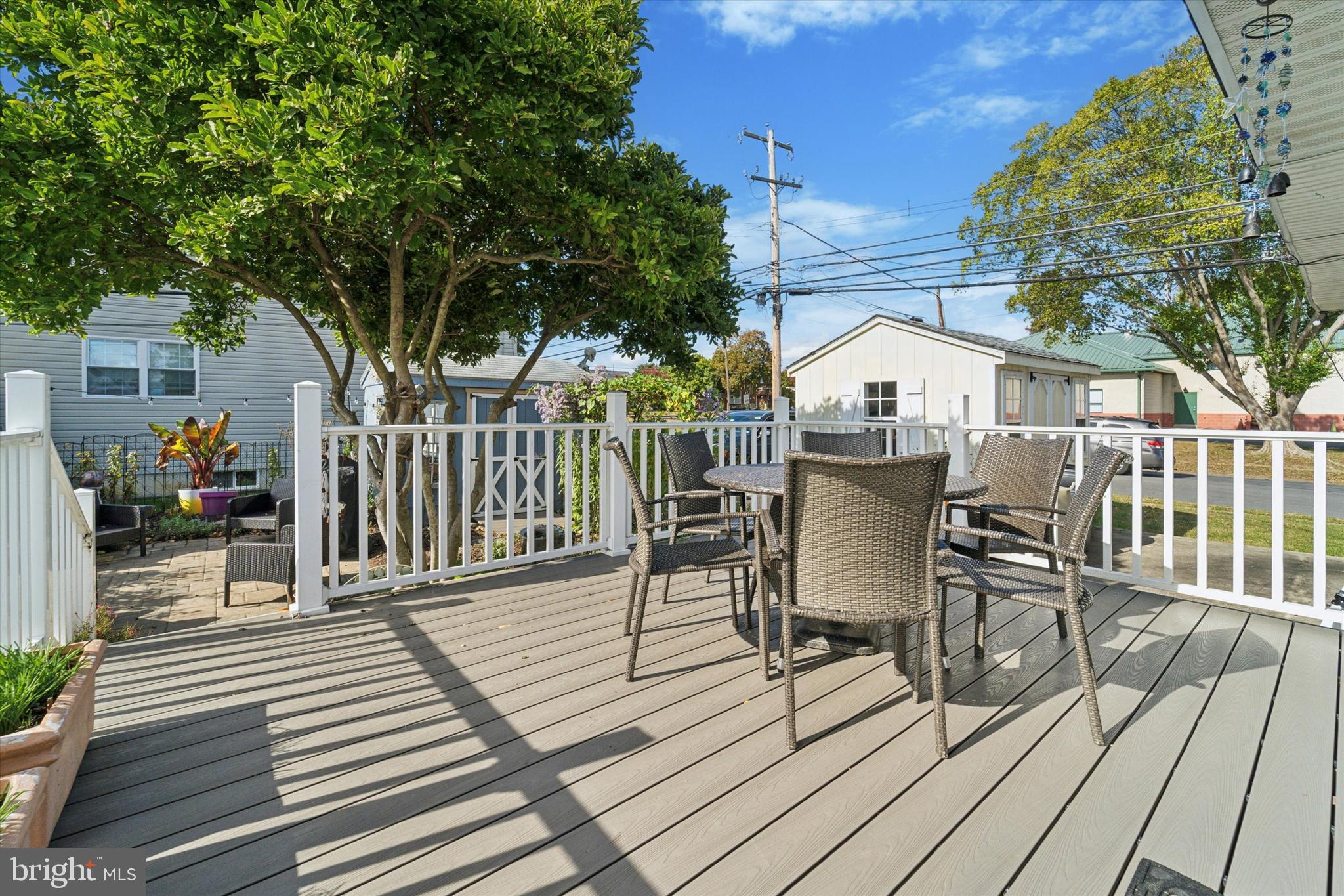 339 Sutton Avenue Folsom, PA 19033 - Photo 23 of 26 a view of a deck with table and chairs and wooden floor