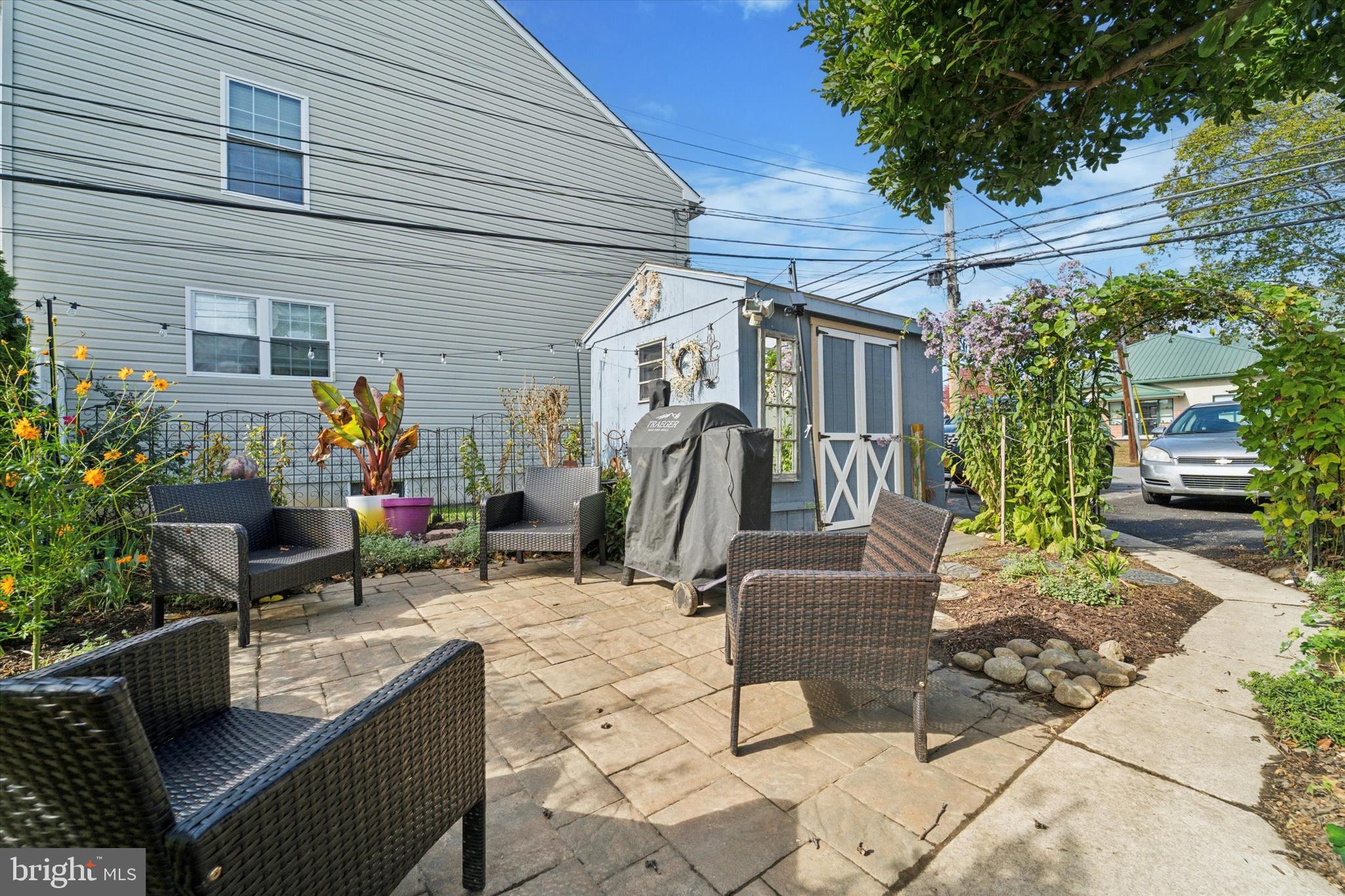 339 Sutton Avenue Folsom, PA 19033 - Photo 24 of 26 a living room with furniture and flowers