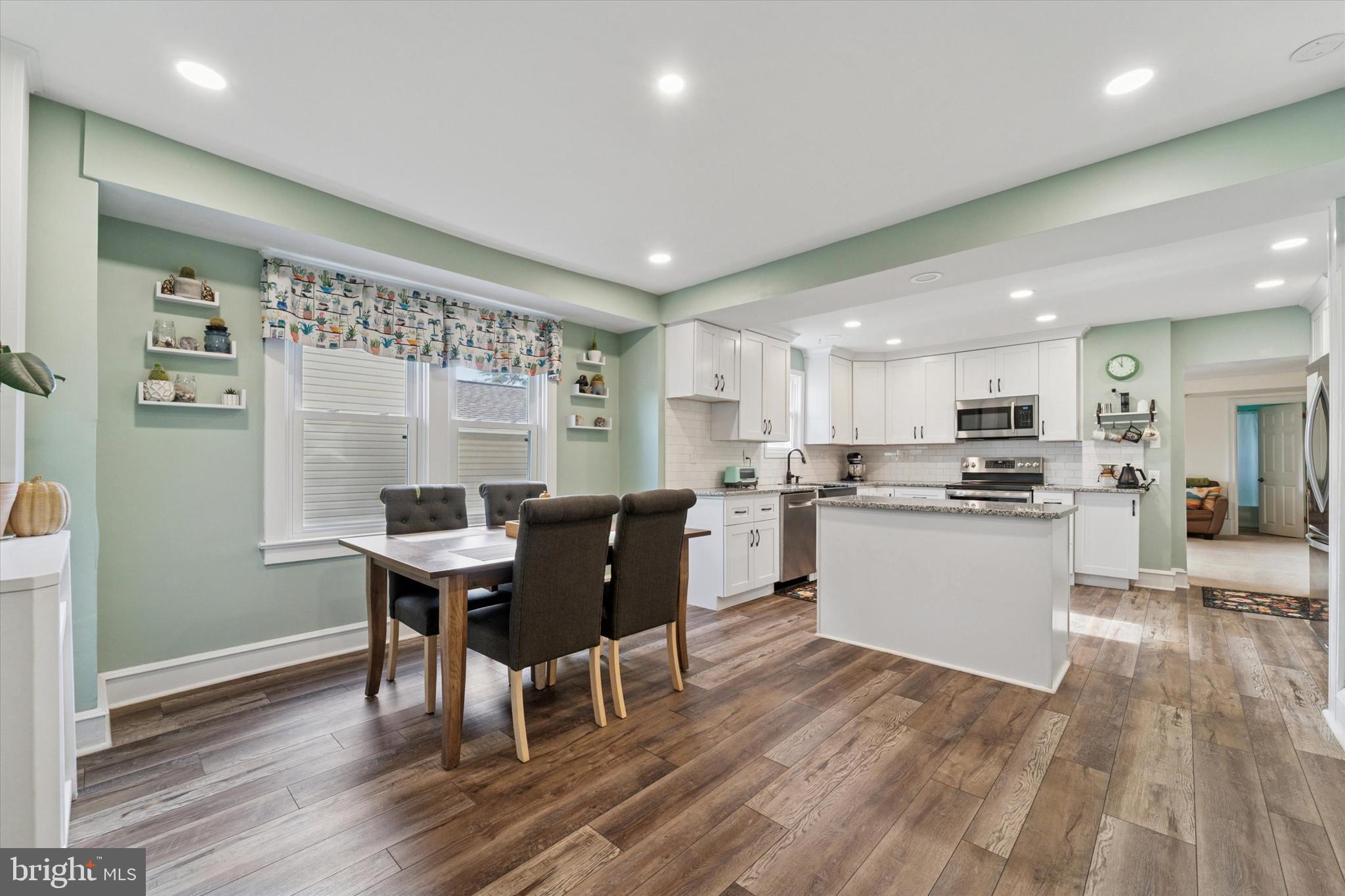 339 Sutton Avenue Folsom, PA 19033 - Photo 5 of 26 a kitchen with a table and chairs in it