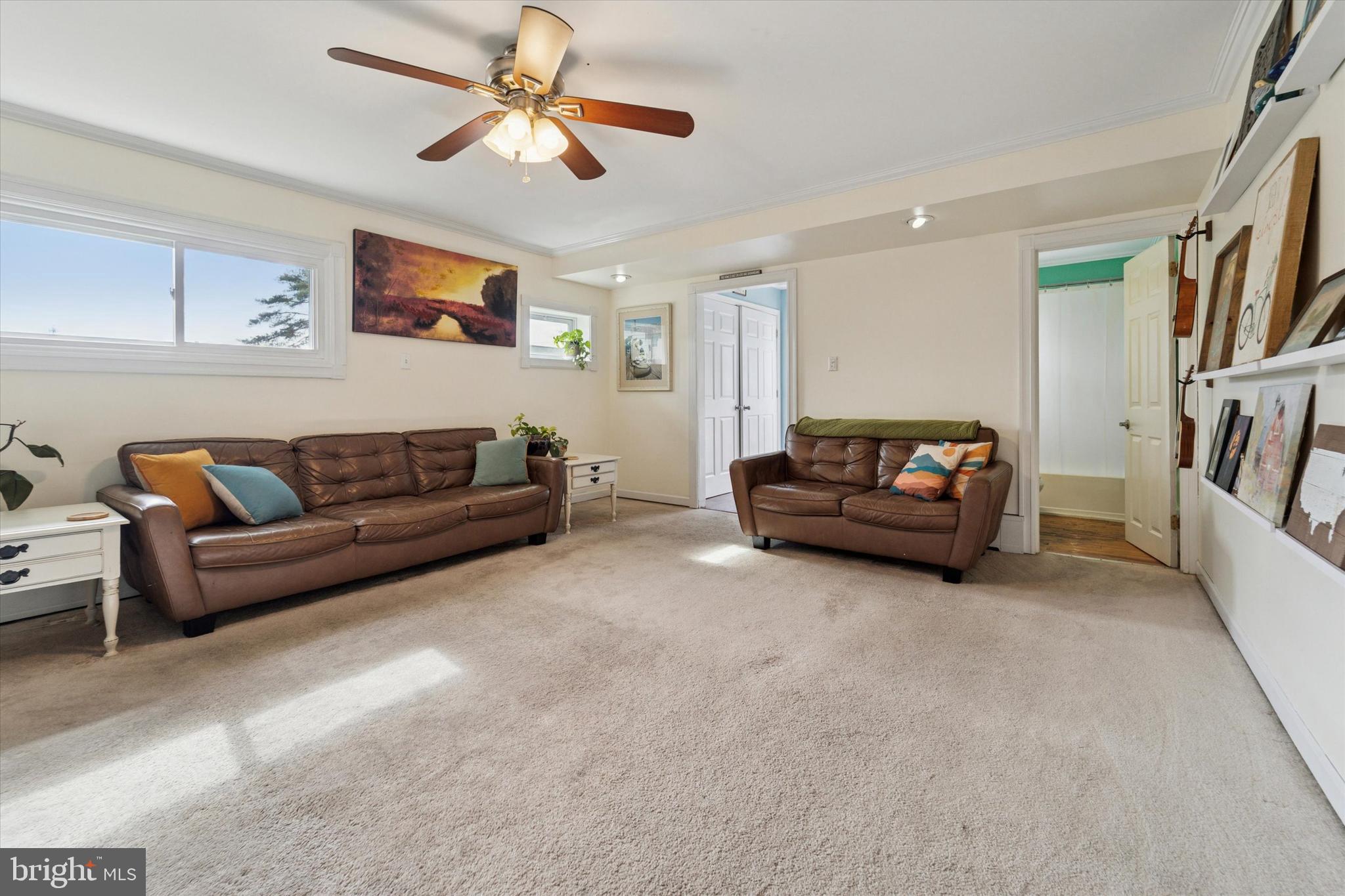 339 Sutton Avenue Folsom, PA 19033 - Photo 10 of 26 a living room with furniture and a ceiling fan