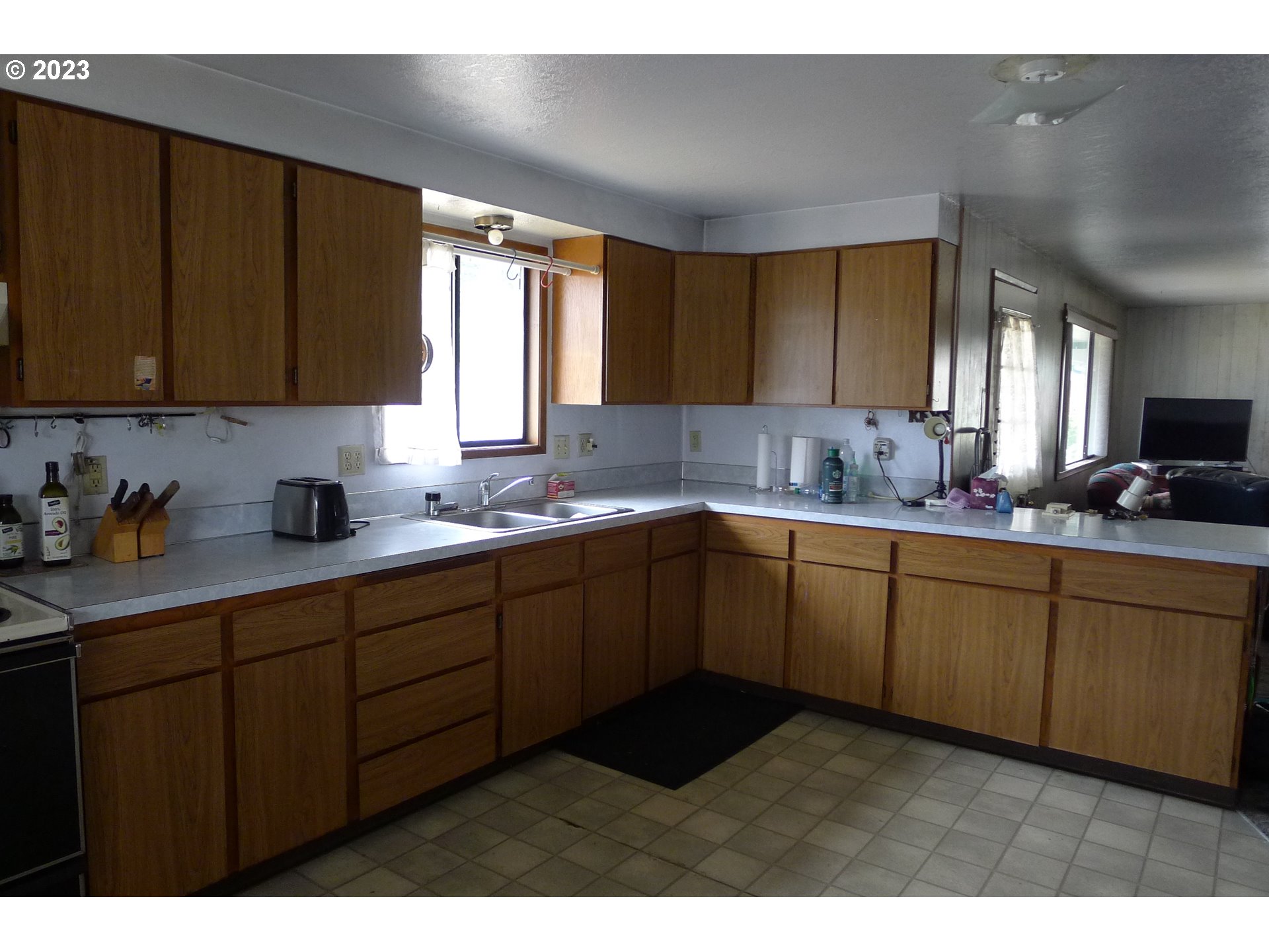 238 North 9th Street Reedsport, OR 97467 - Photo 15 of 38 a kitchen with sink cabinets and window