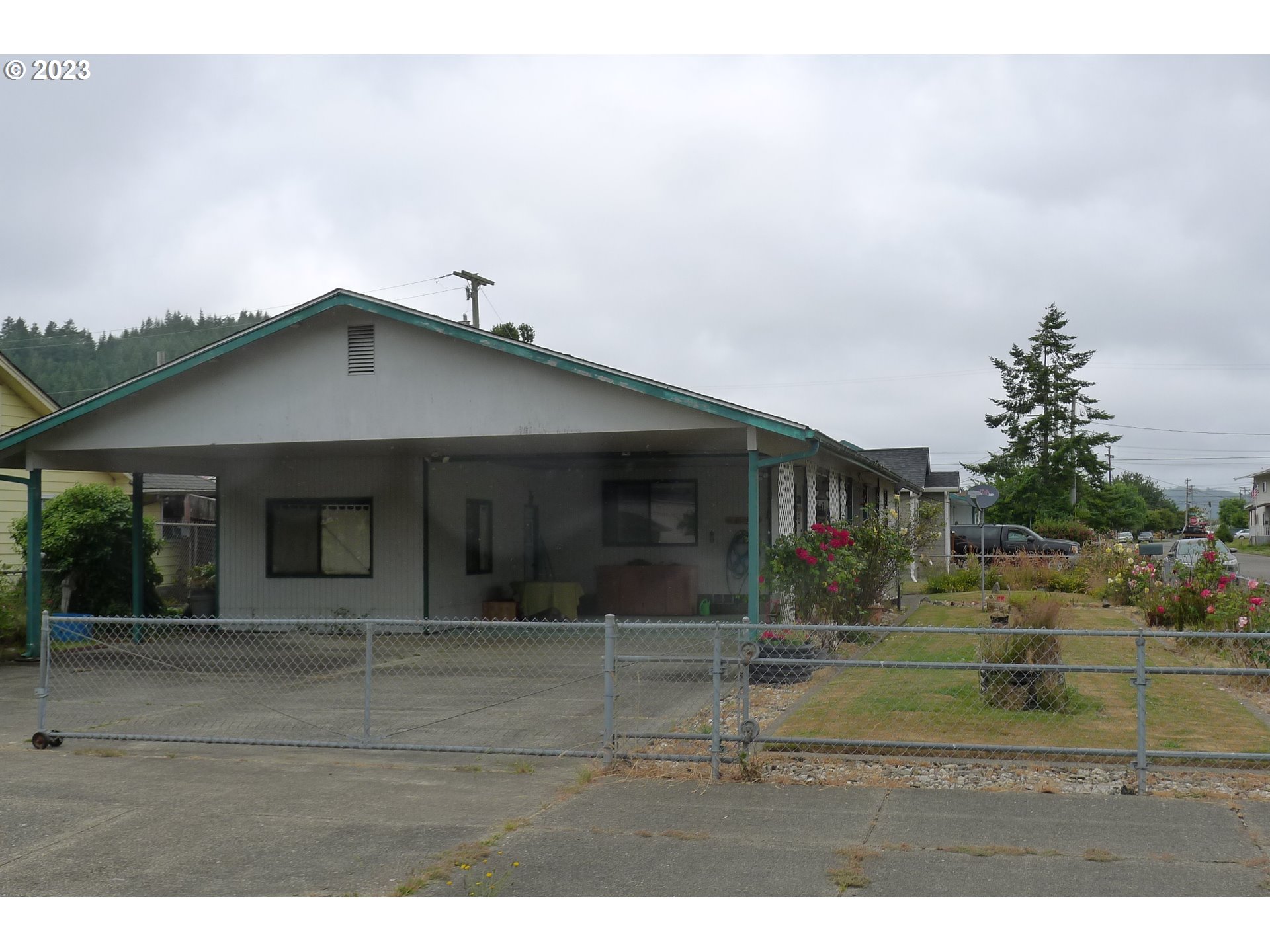 238 North 9th Street Reedsport, OR 97467 - Photo 3 of 38 a view of a house with a yard