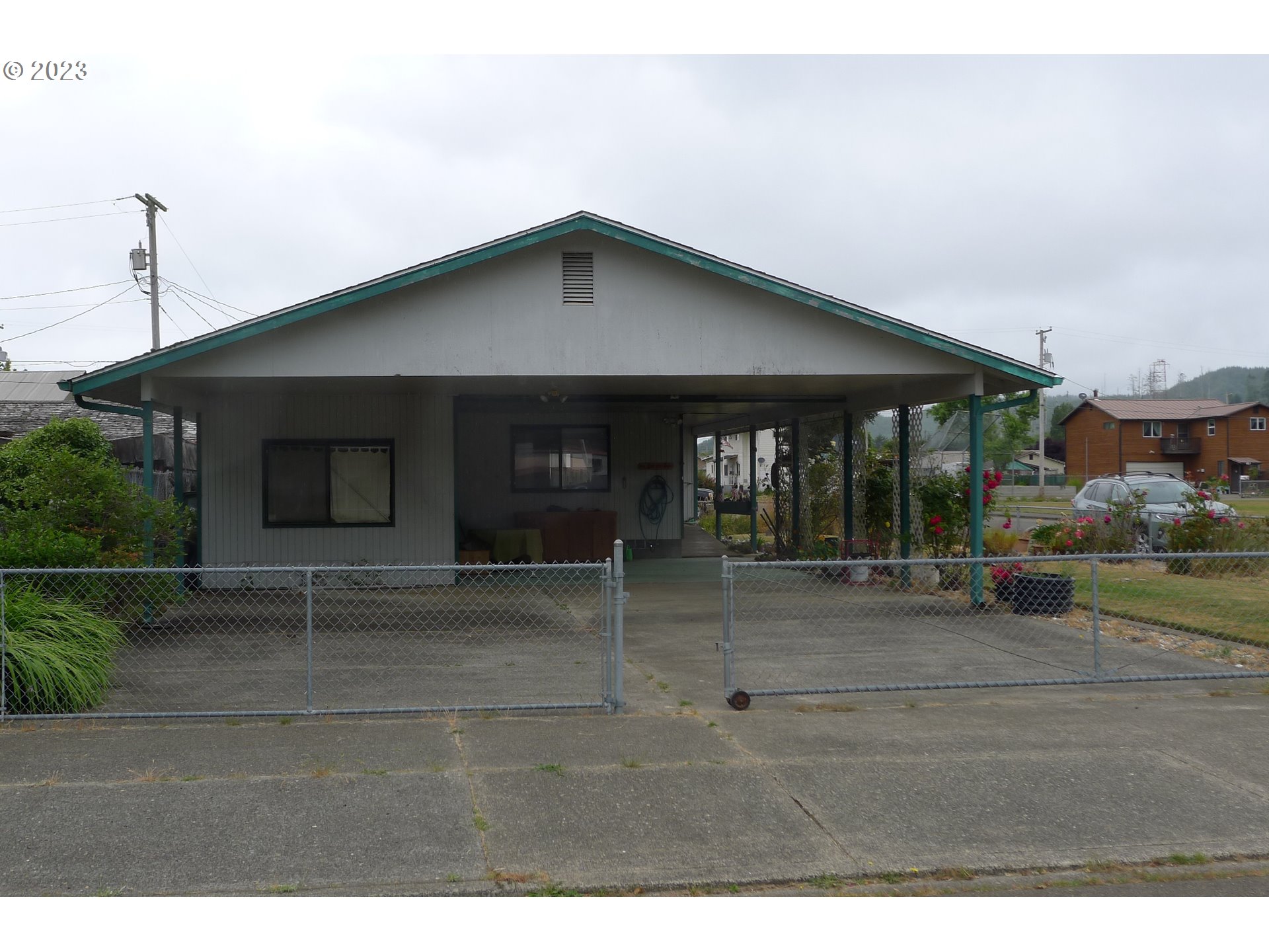 238 North 9th Street Reedsport, OR 97467 - Photo 4 of 38 a view of a house with a porch